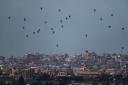 Parachutes drop supplies into the northern Gaza Strip.