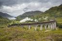 The world famous train crosses the Glenfinnan Viaduct