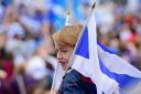 GLASGOW, SCOTLAND - SEPTEMBER 14:  Pro independence supporters march through Glasgow on route to the BBC Scotland where they staged a protest against their perceived bias on September 14, 2014 in Glasgow,Scotland. The latest polls in Scotland's
