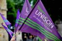 Protesters holding Unison flags
