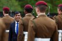 Prime Minister Rishi Sunak smiles as he inspects the Passing Out Parade of the Parachute Regiment recruits during his visit to the Helles Barracks at the Catterick Garrison in early May