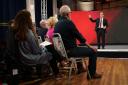 Keir Starmer faces members of the public during a General Election event