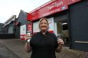 A Greenock barber is back in business just days after a devastating fire tore through her premises.