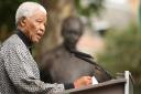 Former South African President Nelson Mandela addresses the crowd during a statue unveiling ceremony in his honour at Parliament Square, London