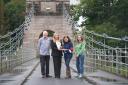 Customer Relationship Manager Diane Rowe (second left) presents the award to Friends of Union Chain Bridge members, from left, Founding Trustee and Honorary Secretary Edward Cawthorn; Chair Martha Andrews; and founding member Heather Thompson.