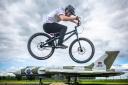 Cycling stunt team The Clan practice ahead of 360 Fest at the National Museum of Flight