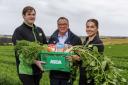 Asda Huntly produce colleague Rhys McWilliam, owner of Benzies Produce Philip Benzies and Asda Hunty section leader Rebecca MacDougall