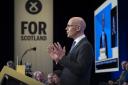 John Swinney delivering his address at the SNP conference