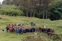 A lone piper leads the islanders of Eigg off to celebrations after the ceremony to unveil a plaque commemorating the historic purchase of the island by its residents