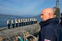 Labour's Defence Secretary John Healey surveys a UK nuclear submarine as it returns from extended patrol