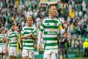 Callum McGregor celebrates in front of the crowd after Rangers victory