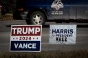 TRAVERSE CITY, MICHIGAN - SEPTEMBER 26: Signs showing support for both Democratic presidential candidate Vice President Kamala Harris and Republican presidential candidate former President Donald Trump sit along a rural highway on September 26, 2024 near