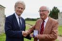 Glasgow Golf Club archivist Nevin McGhee (right) receives the Murdoch Medal from previous recipient Alastair Johnston