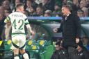 Celtic manager Brendan Rodgers, right, gives out instructions to his captain Callum McGregor at Parkhead on Tuesday night