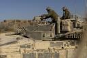 An Israeli soldier patrols near the border with the Gaza Strip