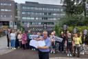 Friends of Hawhead Cemetery gathered to hand over a petition in June