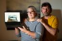 Couple Sophie Davidson and Michael Law, from Alford, Aberdeenshire, say they were misled when they attempted to buy a caravan. They are pictured holding a laptop displaying the seller's website, which still has the caravan they were given on it.