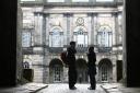 Edinburgh University students at Old College sunday wait for the library to open..