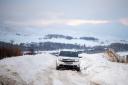 A car struggles through snow in Aberdeenshire