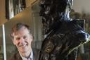 Professor Miles Padgett with a bust of Lord Kelvin on display at The Hunterian