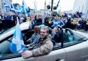 Yes campaigners drive through George Square at a rally during the final day of campaigning for the Scottish referendum