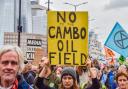 Protesters at an Extinction Rebellion demonstration show their opposition to Cambo