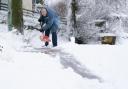 A man clears the snow in Leadhills, South Lanarkshire as Storm Barra hit Scotland with disruptive winds, heavy rain and snow. Photo: PA