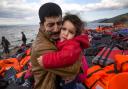 LESBOS, GREECE - OCTOBER 25: An Iraqi father cries as he holds his daughter after arriving safely on Greek shores October 25,2015, on Lesbos. Cold weather and rough seas have done little to stem the endless flow of desperate people fleeing war or poverty