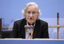 Noam Chomsky is alive and continues to recover from a stroke he suffered last year, according to his wife