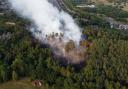 Scottish firefighters tackle a blaze in a woodland in 2022