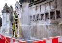 Workers clean white paint from the Palace of Westminster. Picture: Victoria Jones