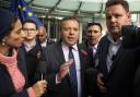 'Bad boy of Brexit' Arron Banks (centre) was accused of bringing a SLAPP against journalist Carole Cadwalladr