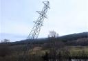 A transmission tower in Killin within the Loch Lomond and Trossachs National Park being brought down