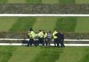 Police officers respond to Animal Rising activists attempting to invade the race course