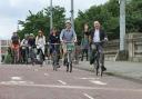 Green minister Patrick Harvie cycles with others on the South City Way in Glasgow