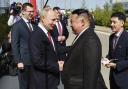 Russian President Vladimir Putin, left, and North Korea's leader Kim Jong Un shake hands