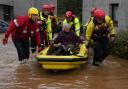 Members of the emergency services help local residents to safety in Brechin