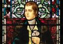 The Robert Burns stained-glass window in the Bute Hall at the University of Glasgow