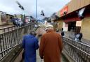 Pigeons fly over the heads of two senior citizens in Kirkcaldy. Archive photo