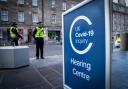 Police officers outside the main entrance to the UK Covid-19 Inquiry hearing at the Edinburgh International Conference Centre (EICC).