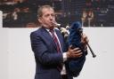 Alastair Campbell plays the bagpipes to mark 25 years of the Good Friday Agreement in Belfast in 2023