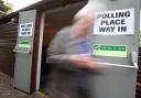 A voter leaves Broomhouse Community Hall polling station in Glasgow after casting their vote for the local council elections.