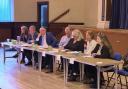 A closer view of the convenor and speakers at the hustings.Seated at the table in the middle is convenor Ron McAulay, Chairman of Strathpeffer and District Community Council.Surrounding him, left to right:Maree Todd (SNP)David Green (Scottish Lib