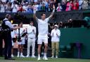Andy Murray takes in a standing ovation at Wimbledon