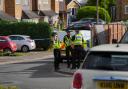 A view of police at the scene in Ashlyn Close, Bushey, Hertfordshire