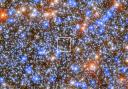 ESA, Hubble & NASA handout photo of a colored ESA/Hubble image of an area where a black hole that has been observed in the star cluster called Omega Centauri, a collection of around ten million stars.