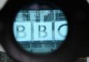 File photo of the BBC office building seen through a camera lens
