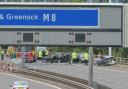 Two police officers were raced to hospital after a smash on Glasgow's M8
