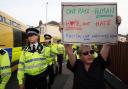 A woman was spotted holding up a 'hope not hate' sign in the middle of a violent riot in Southport