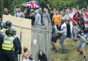 Far-right rioters clash with police outside a Holiday Express in Manvers